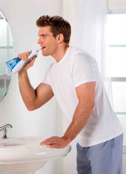 wp-450-cordless-plus-water-flosser-in-use